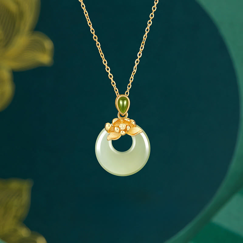Hetian Jade Lotus Peace Buckle Necklace - jade disc with gold lotus bail on teal backdrop, Graceful