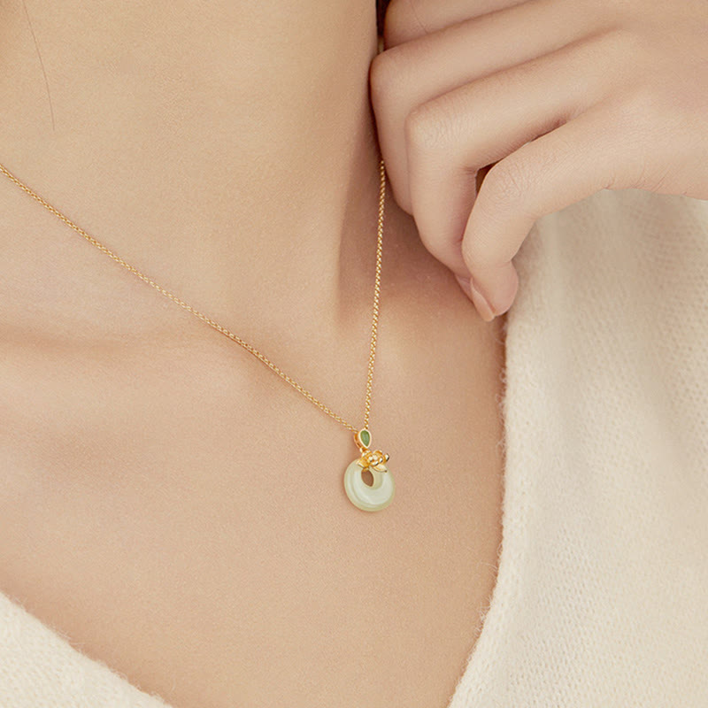 Hetian Jade Lotus Peace Buckle Necklace - worn on model at collarbone with knit top, Wearable