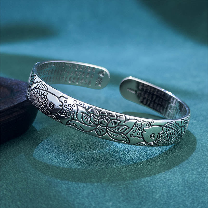 Heart Sutra Koi Fish Copper Bracelet – open cuff with koi, lotus and inner sutra text, oxidized finish on teal