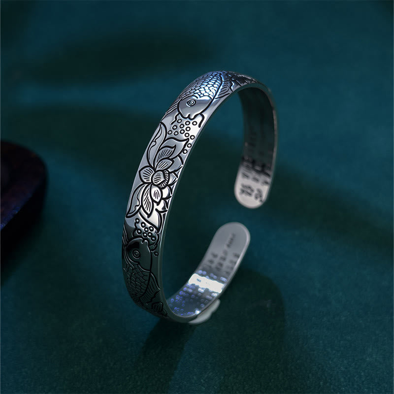 Heart Sutra Koi Fish Copper Bracelet – three-quarter side view of koi and lotus engraving, oxidized patina on teal