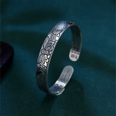 Heart Sutra Koi Fish Copper Bracelet – three-quarter side view of koi and lotus engraving, oxidized patina on teal