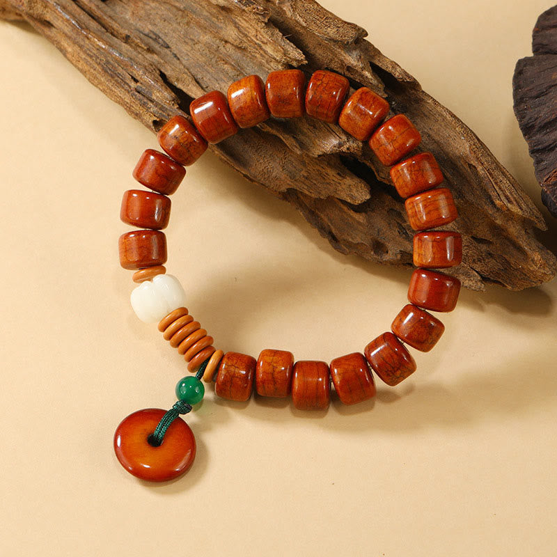Bone Beads Lotus Peace Buckle Enlightenment Bracelet – top-down view of cylindrical beads with disc pendants, natural
