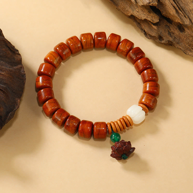 Bone Beads Lotus Peace Buckle Enlightenment Bracelet – overhead view of reddish-brown barrel beads with white focal, bohemian