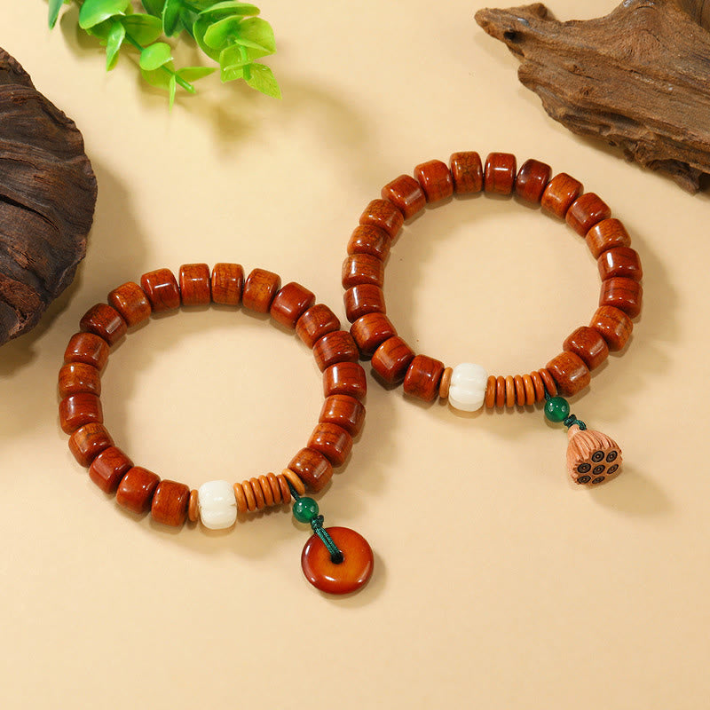 Bone Beads Lotus Peace Buckle Enlightenment Bracelet – two bracelets stacked with peace disc and lotus pod charms, peaceful