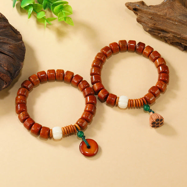 Bone Beads Lotus Peace Buckle Enlightenment Bracelet – two bracelets stacked with peace disc and lotus pod charms, peaceful