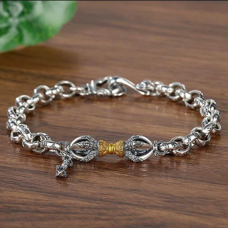 Copper Vajra Om Mani Padme Hum Bracelet – silver vajra centerpiece with gold accent on wooden surface, spiritual jewelry Main image