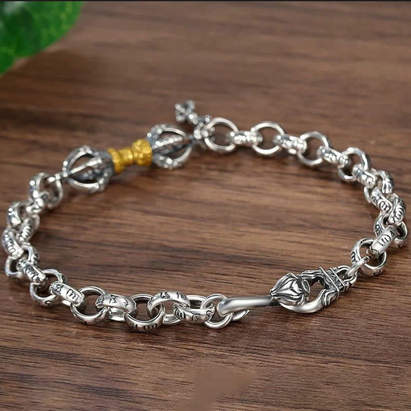 Copper Vajra Om Mani Padme Hum Bracelet – three-quarter view revealing vajra thunderbolt design with gold band on wood