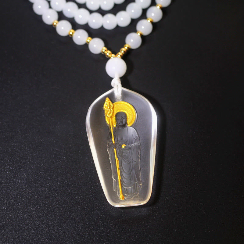Tibetan Liuli Crystal Ksitigarbha Necklace – clear white pendant on white bead chain, black background
