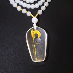 Tibetan Liuli Crystal Ksitigarbha Necklace – clear white pendant on white bead chain, black background