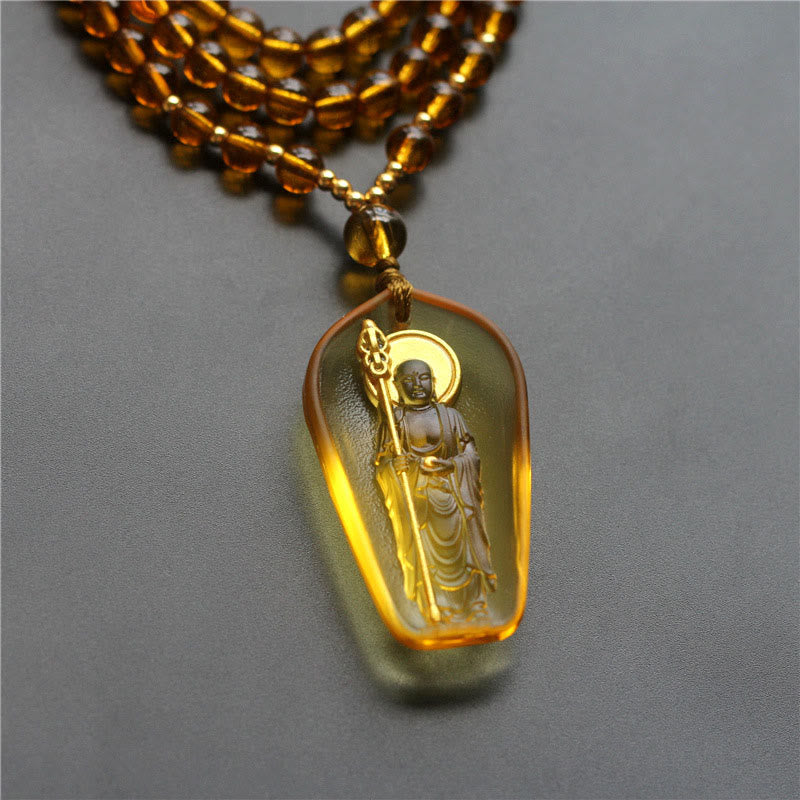 Tibetan Liuli Crystal Ksitigarbha Necklace – amber pendant on gold bead chain, warm glow, front