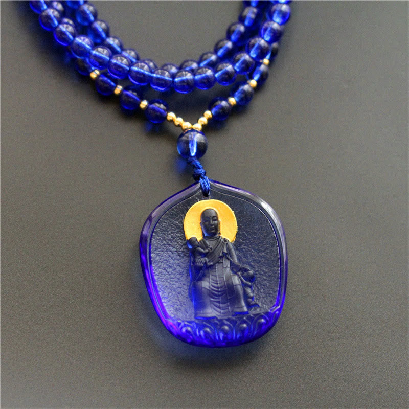 Tibetan Liuli Crystal Ksitigarbha Necklace – deep blue seated Bodhisattva pendant, blue beads, front