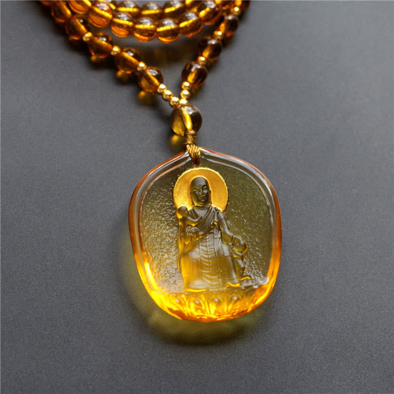 Tibetan Liuli Crystal Ksitigarbha Necklace – amber seated Bodhisattva pendant, gold beads, front