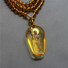 Tibetan Liuli Crystal Ksitigarbha Necklace – amber pendant on gold bead chain, warm glow, front