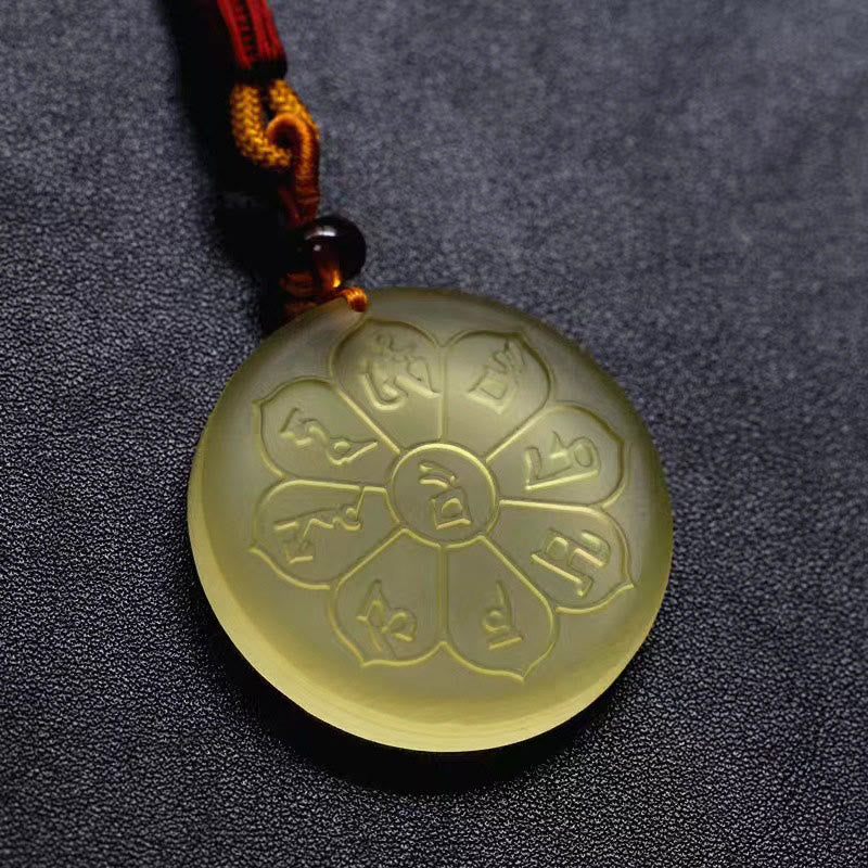 Liuli Crystal Wealth God Mantra Abundance Eight-Petal Necklace – macro of yellow liuli pendant mantra engravings, texture