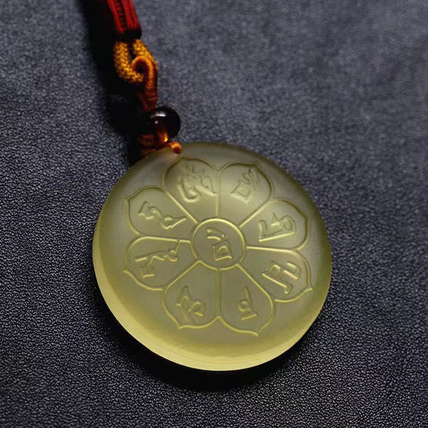 Liuli Crystal Wealth God Mantra Abundance Eight-Petal Necklace – macro of yellow liuli pendant mantra engravings, texture