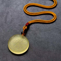 Liuli Crystal Wealth God Mantra Abundance Eight-Petal Necklace – yellow liuli eight-petal pendant on cord, studio shot