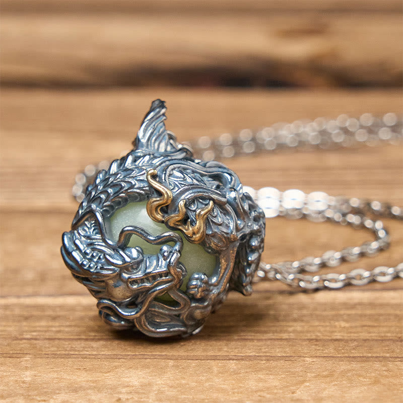 Copper Dragon Pendant Necklace – close-up dragon head scales with green jade center on wood, Strength