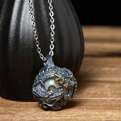 Copper Dragon Pendant Necklace – coiled dragon sphere with gold flame accents on black prop, Protection