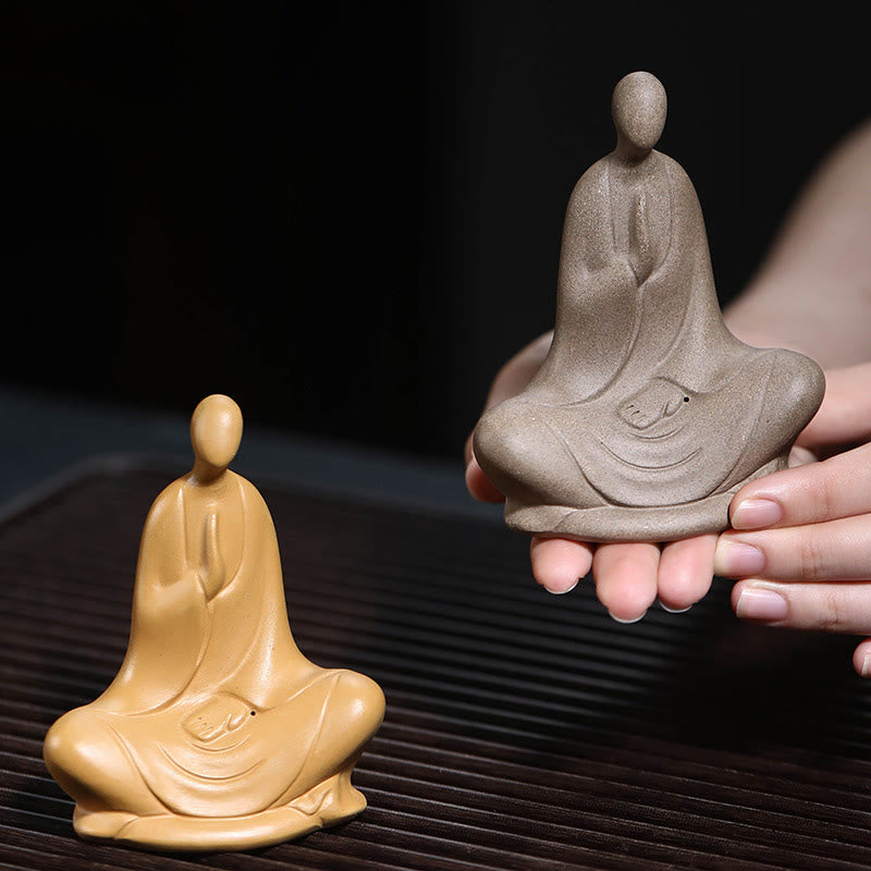 Ceramic Formless Buddha Prayer Statue – two color variants held in hands, gray and tan, size comparison, tea ceremony setting
