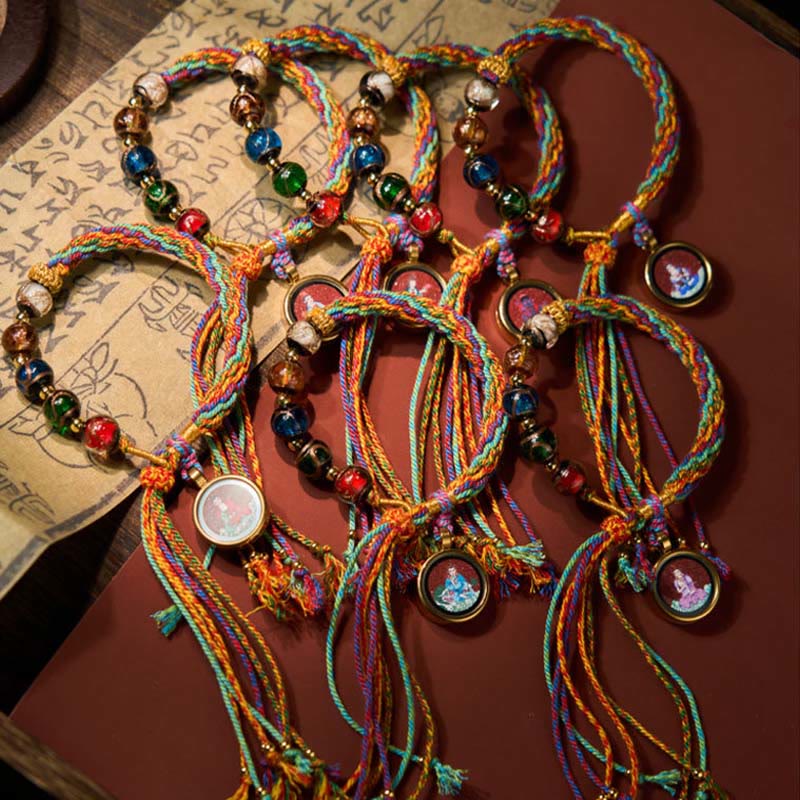 Zodiac Natal Buddha Cinnabar Bracelet – close-up of string weaving between, cinnabar bracelet, zodiac Buddha, red string