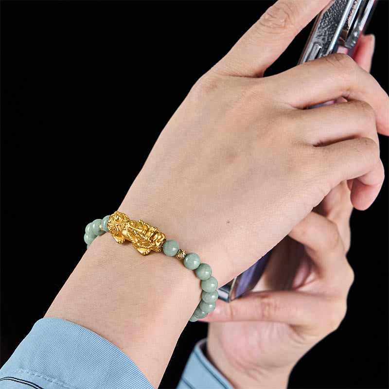Golden Pi Xiu Charm Jade Prosperity Beaded Bracelet – Two green jade Pi Xiu bracelets displayed on white plate, pair set