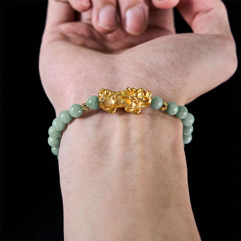 Golden Pi Xiu Charm Jade Prosperity Beaded Bracelet – Bracelet on wrist back view with black background, gold Pi Xiu detail