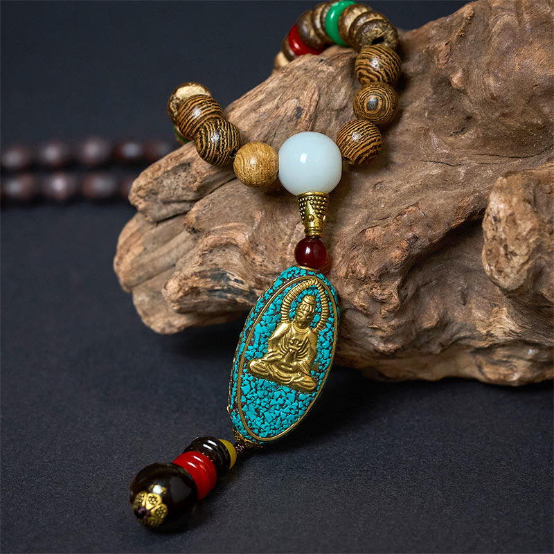 Vintage Nepal Avalokitesvara Necklace – macro closeup of gold Avalokitesvara pendant on driftwood, sacred detail