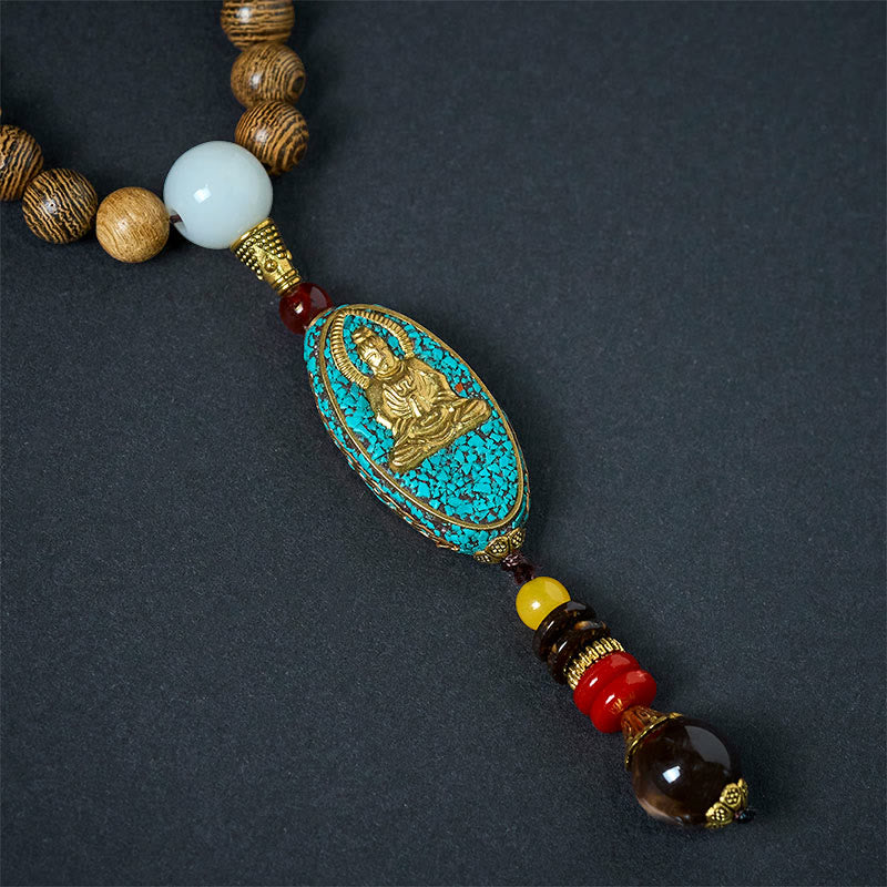 Vintage Nepal Avalokitesvara Necklace – front closeup of gold deity on turquoise inlay with crystal drop, sacred art