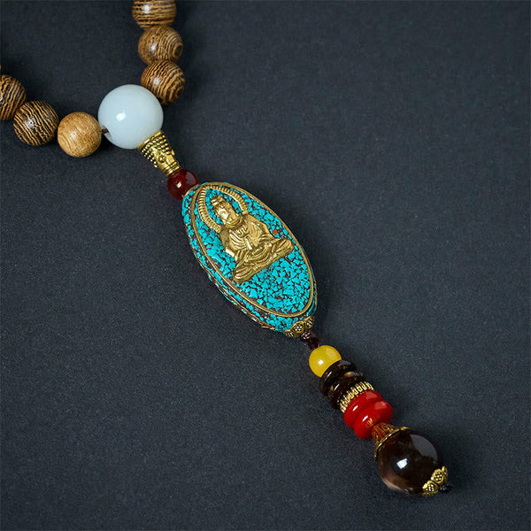 Vintage Nepal Avalokitesvara Necklace – front closeup of gold deity on turquoise inlay with crystal drop, sacred art