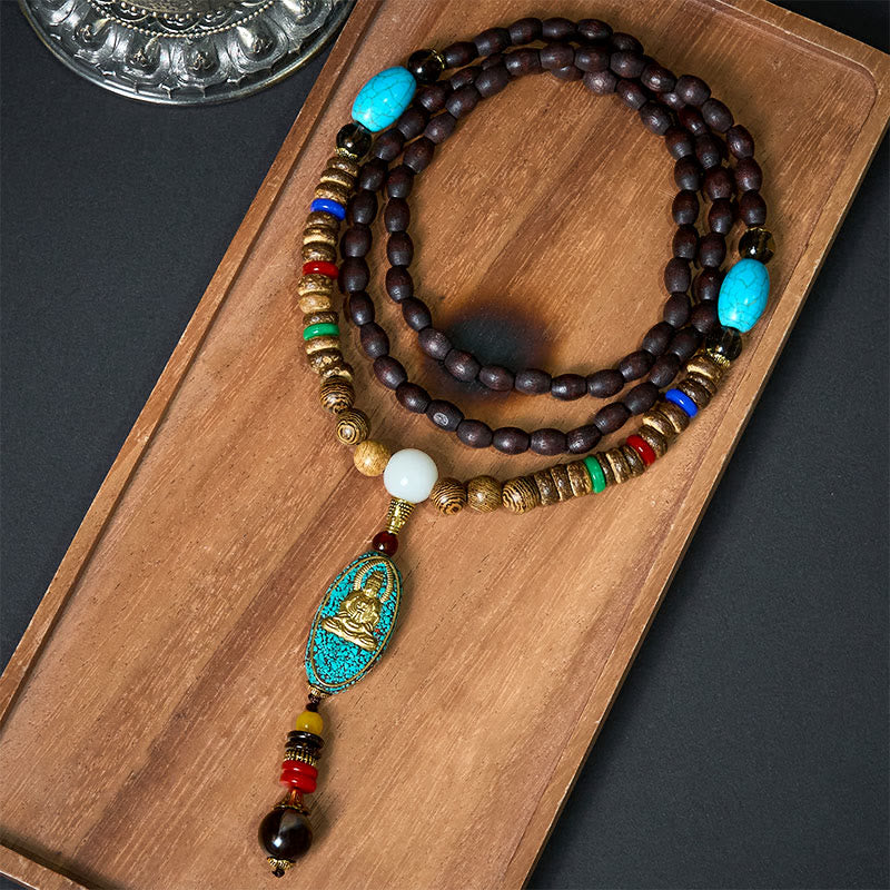 Vintage Nepal Avalokitesvara Necklace – flatlay on wooden tray with turquoise pendant and beads, spiritual jewelry
