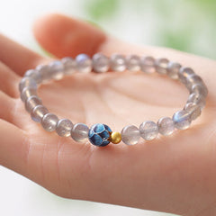 Natural Moonstone Lotus Bracelet – moonstone lotus bead on palm, natural light