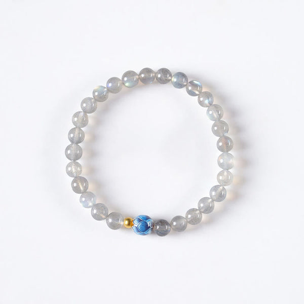 Natural Moonstone Lotus Bracelet – full moonstone strand with lotus accent, white bg