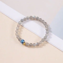 Natural Moonstone Lotus Bracelet – moonstone with lotus bead angled view, calm