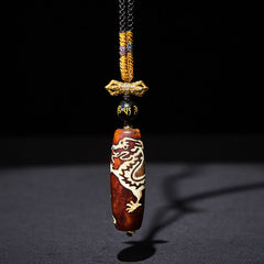 Tibetan Agate Nine-Eye Dzi Dragon Necklace Pendant – angled view revealing nine-eye circular pattern, Protection