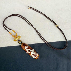 Tibetan Agate Nine-Eye Dzi Dragon Protection Necklace Pendant – worn display showing pendant length on neck, Courage