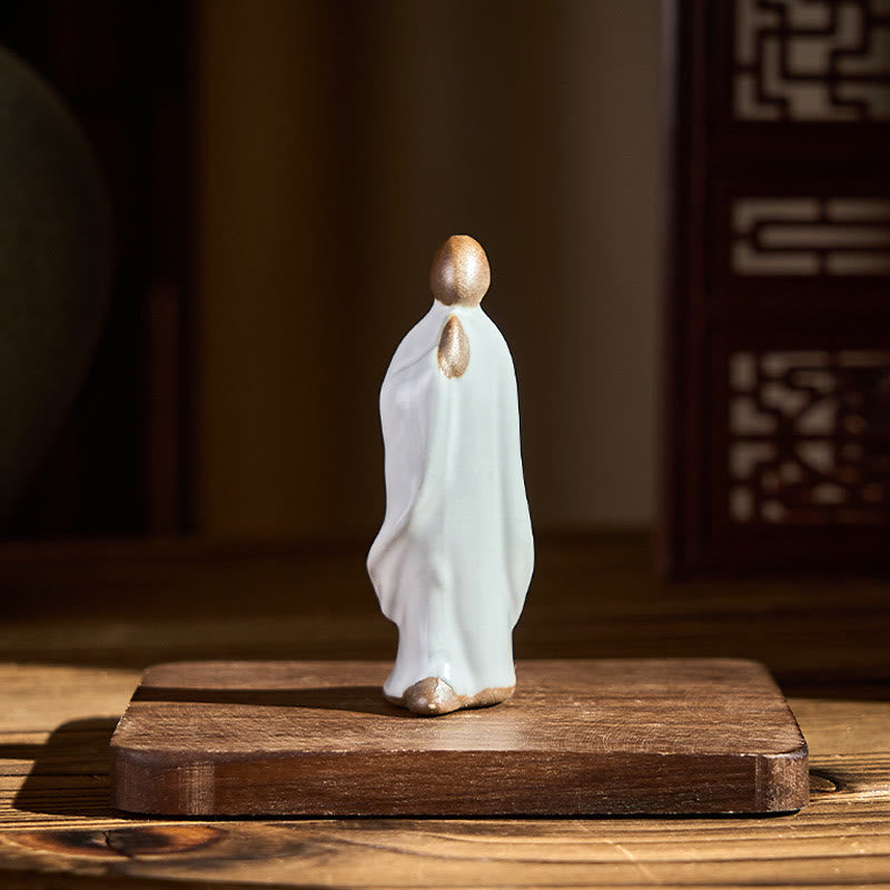 Meditation Monk Ceramic Statue – monk statue in sunlit garden room with fern, monk statue, serenity decor, ceramic figurine