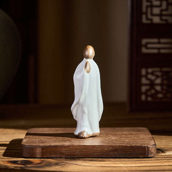 Meditation Monk Ceramic Statue – monk statue in sunlit garden room with fern, monk statue, serenity decor, ceramic figurine