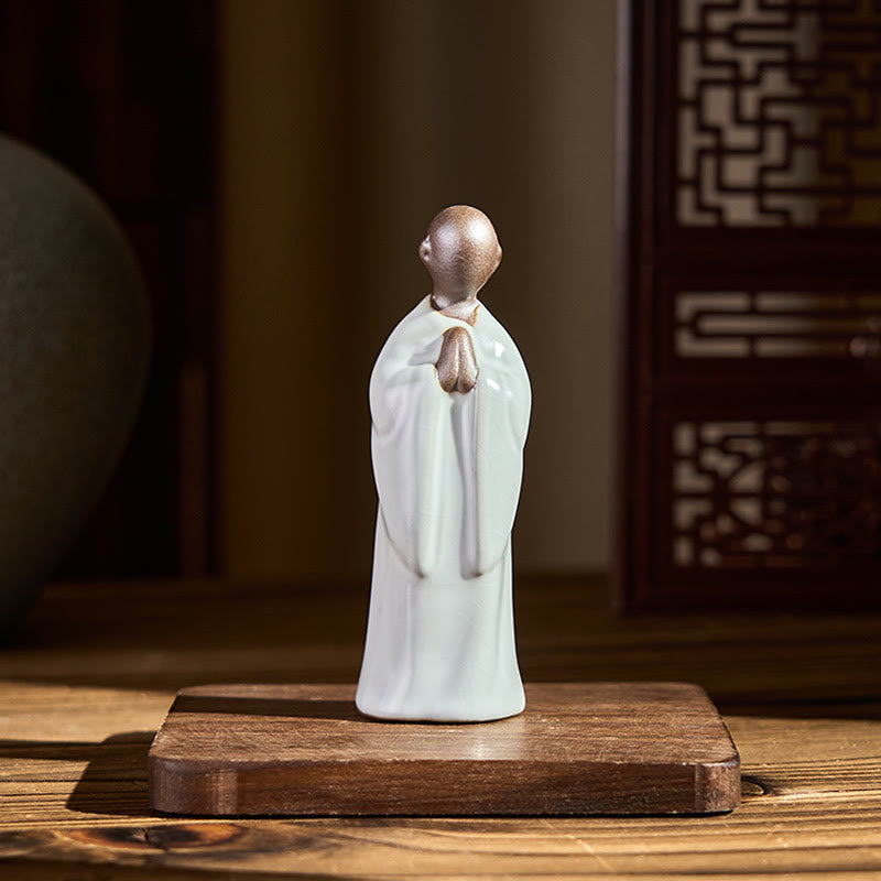 Meditation Monk Ceramic Statue – monk figurine held in palm showing compact, monk statue, serenity decor, ceramic figurine