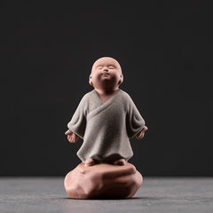 Looking Up Resting Monk Ceramic Statue Compassion Home Decor – side view resting monk, peaceful sitting figurine decoration