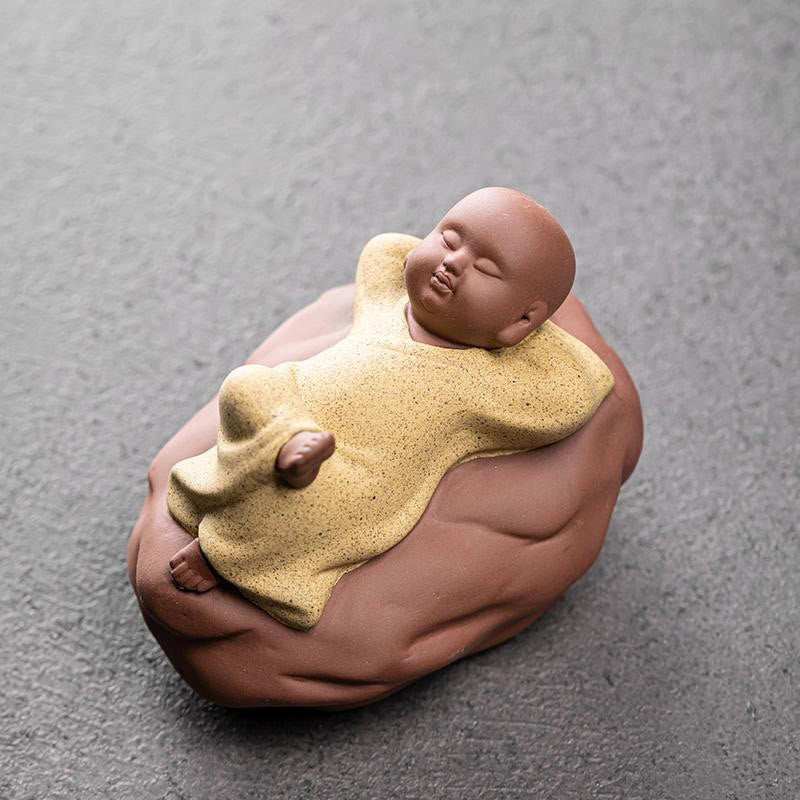 Looking Up Resting Monk Ceramic Statue Compassion Home Decor – looking up pose from low angle, hopeful monk sculpture