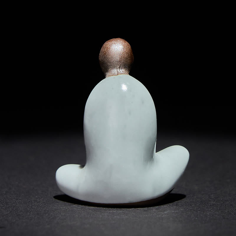 Ceramic Formless Buddha Meditating Statue – back view showing smooth curved robe, pale blue ceramic, brown head, studio light