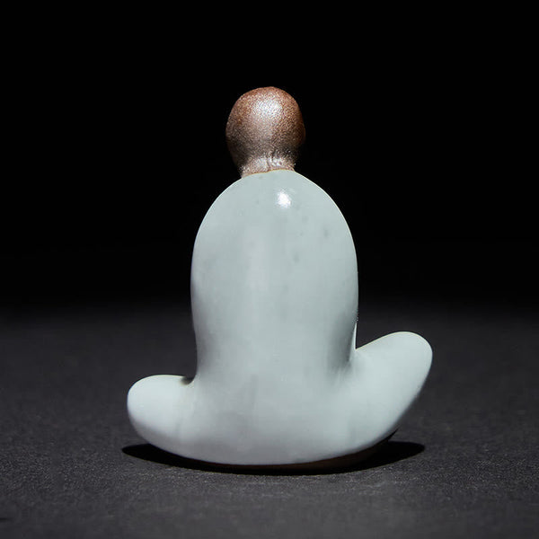 Ceramic Formless Buddha Meditating Statue – back view showing smooth curved robe, pale blue ceramic, brown head, studio light