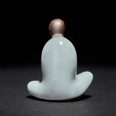 Ceramic Formless Buddha Meditating Statue – back view showing smooth curved robe, pale blue ceramic, brown head, studio light