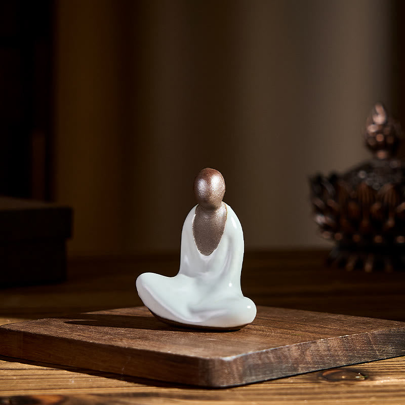 Ceramic Formless Buddha Meditating Statue – on wooden board with incense burner beside, warm ambient light, peaceful meditation space