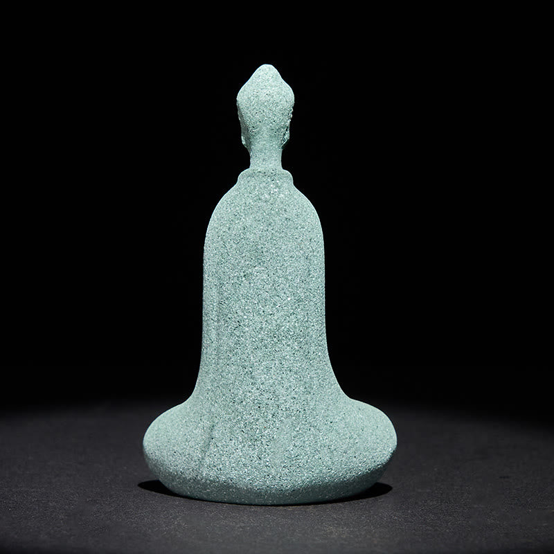 Sandstone Meditation Buddha Desk Statue – back view of flowing silhouette, studio dark backdrop