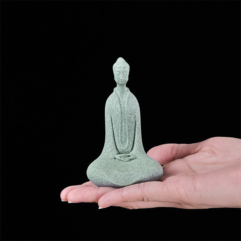 Sandstone Meditation Buddha Desk Statue – resting in open palm showing desk size, scale