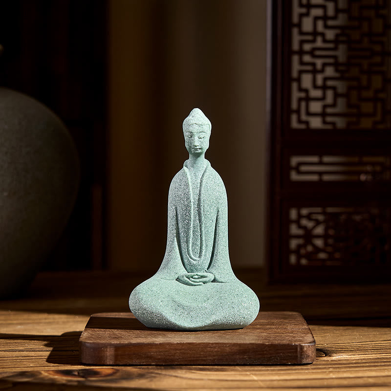 Sandstone Meditation Buddha Desk Statue – on wooden stand with lattice screen backdrop, warm light
