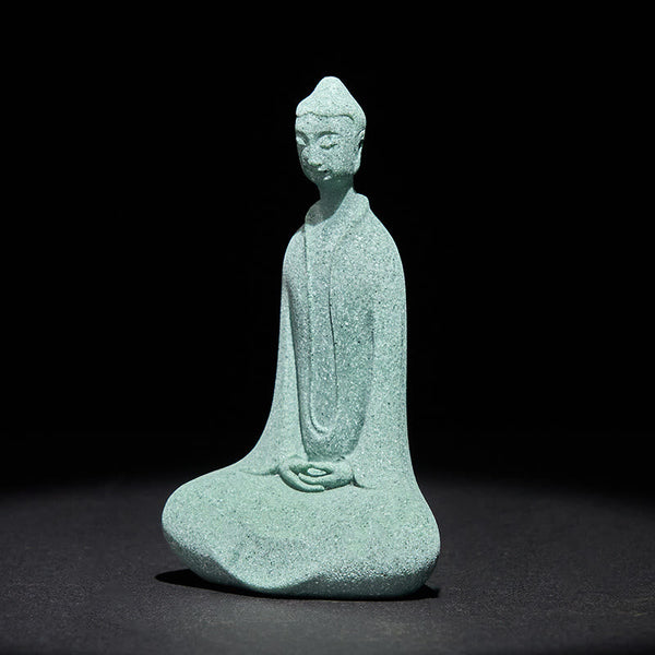 Sandstone Meditation Buddha Desk Statue – angled front view showing long robe folds, studio light