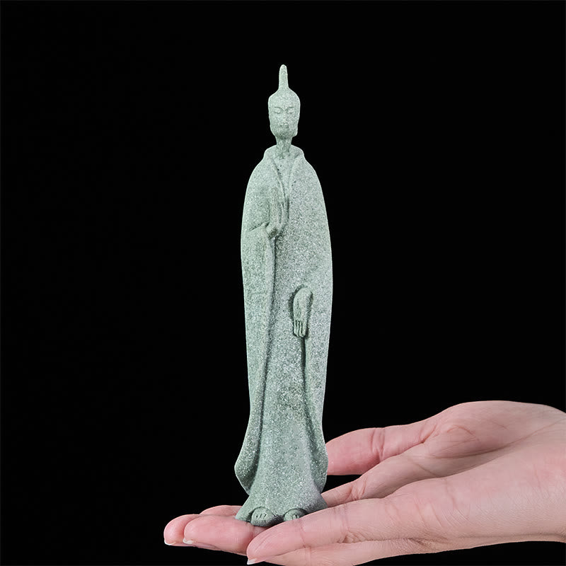 Sandstone Meditation Buddha Standing Statue – held in palm showing scale and sandstone grain texture, size reference