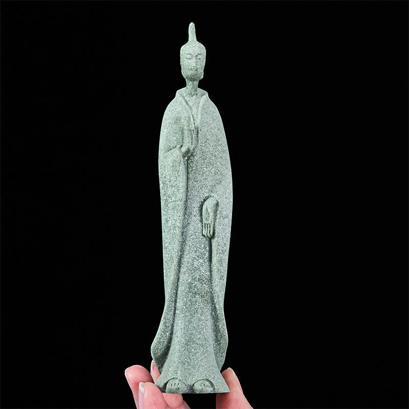 Sandstone Meditation Buddha Standing Statue – held between fingers showing lightweight compact design, portable zen